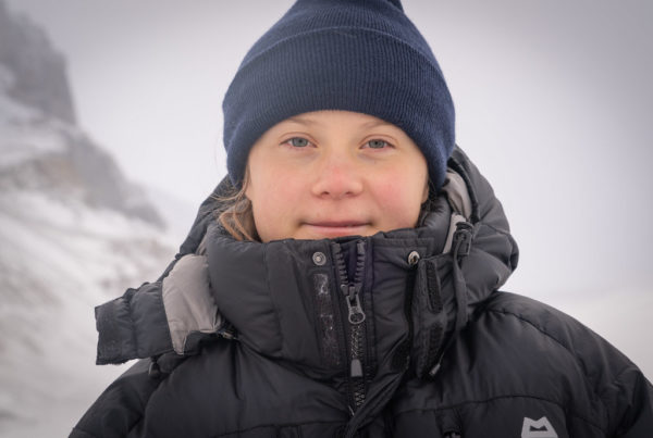 Greta Thunberg in a wearing a parka and beanie at the Columbia Icefield in Jasper National Park.